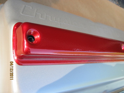 Chrysler FirePower hemi valve cover in Pacific Silver; cover in Wilder Red over Super Chrome