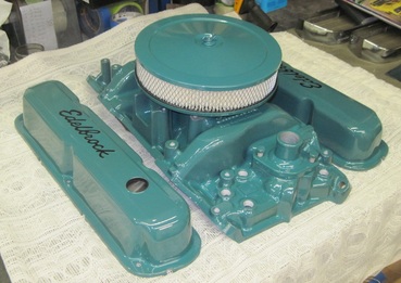 Small block Mopar Edelbrock intake manifold, air cleaner assembly, valve covers and water neck in Clear Vision over Sea Water Teal