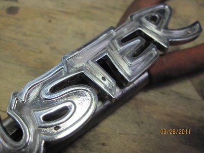 Damaged/pitted Duster emblem on arrival