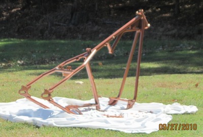 Custom motorcycle frame in Tangelo Mist over Ink Black